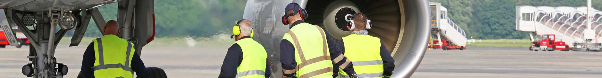 Aviation aerospace line maintenance crew working on a GENEX airliner